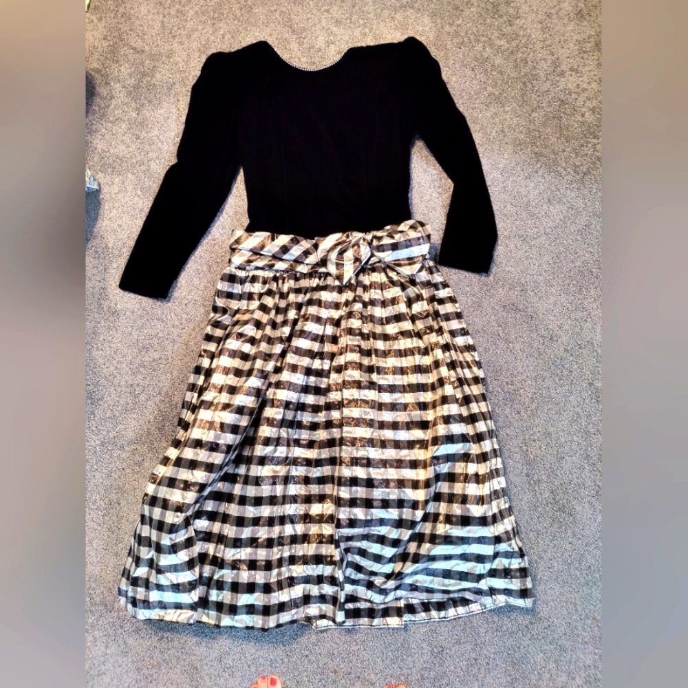Elegant Cocktail Dress with stunning bow. Jeweled Neckline that drops In back